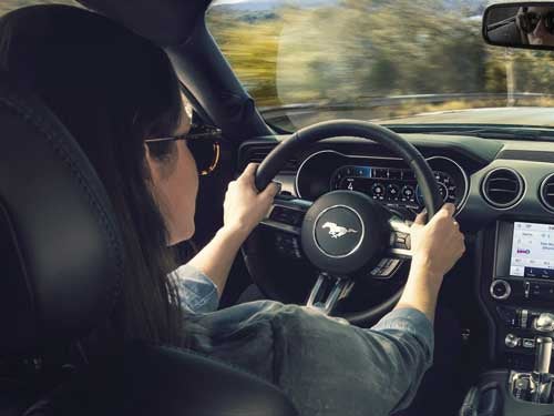 2023 Ford Mustang view of woman holding steering wheel