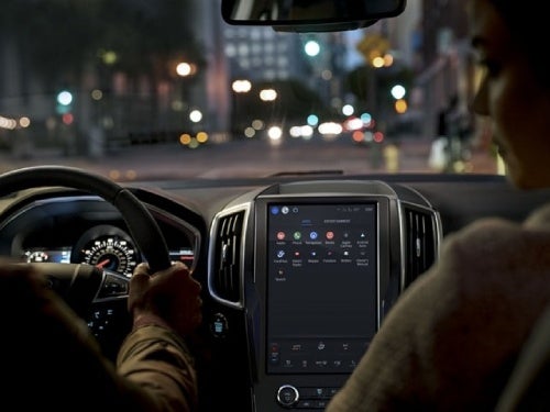 2024 Ford Edge view of couple in front seat driving at night