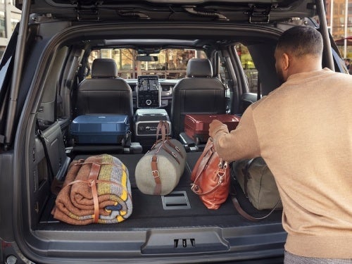 2024 Ford Expedition looking in from the back with the back seats down and the cargo area filled with things