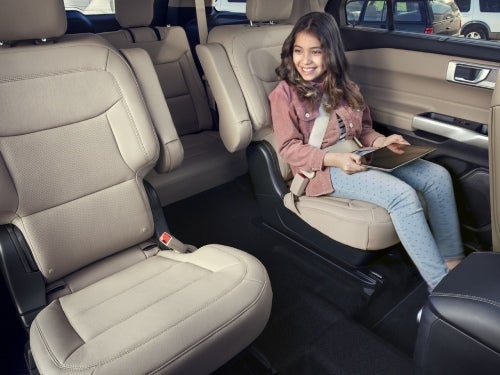 2024 Ford Explorer interior view of back seating area with a child in middle seat