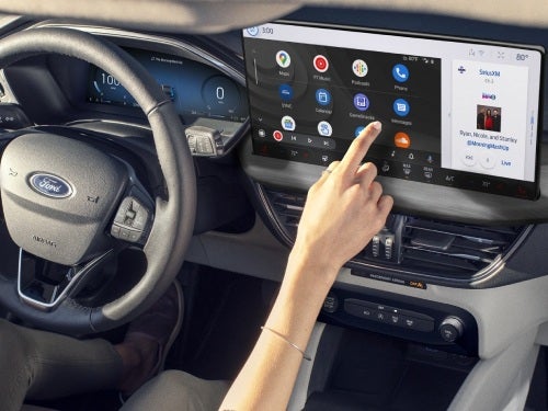 2024 Ford Escape close up view of woman using touchscreen display